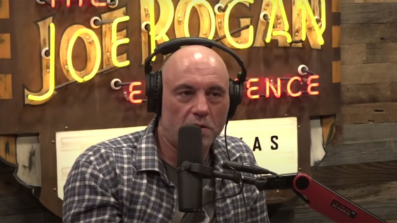 Joe Rogan talking into a microphone on his podcast.