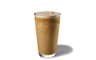 Tall glass with Starbucks Espresso Frappuccino with almond milk