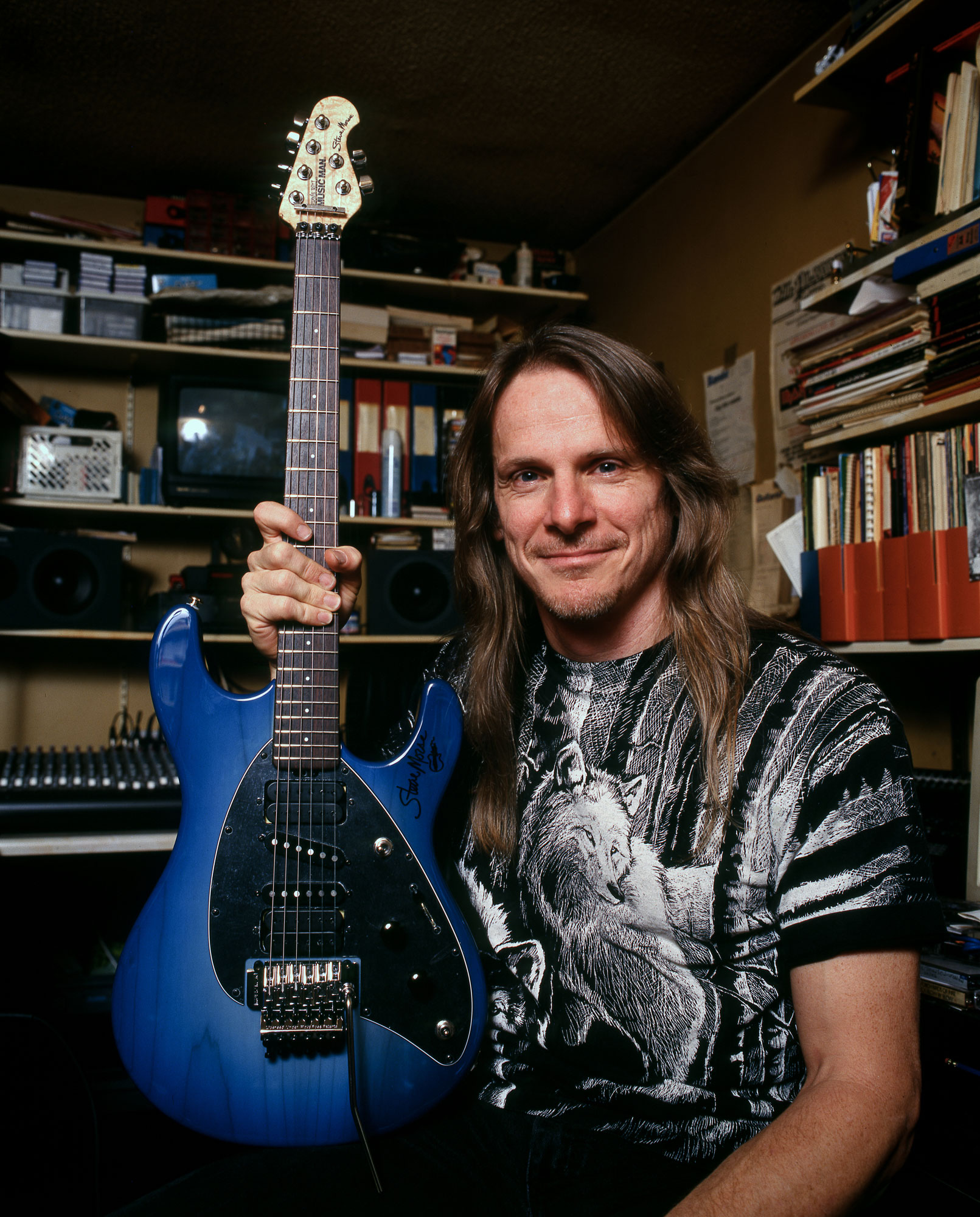 Steve Morse with his blue Ernie Ball Music Man signature guitar in 1997