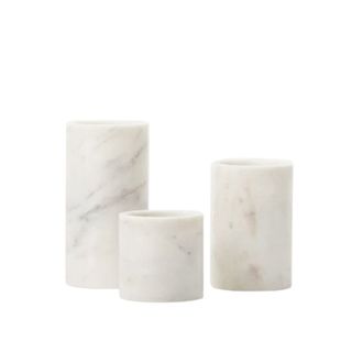 set of 3 marble cylinder pillars in different heights