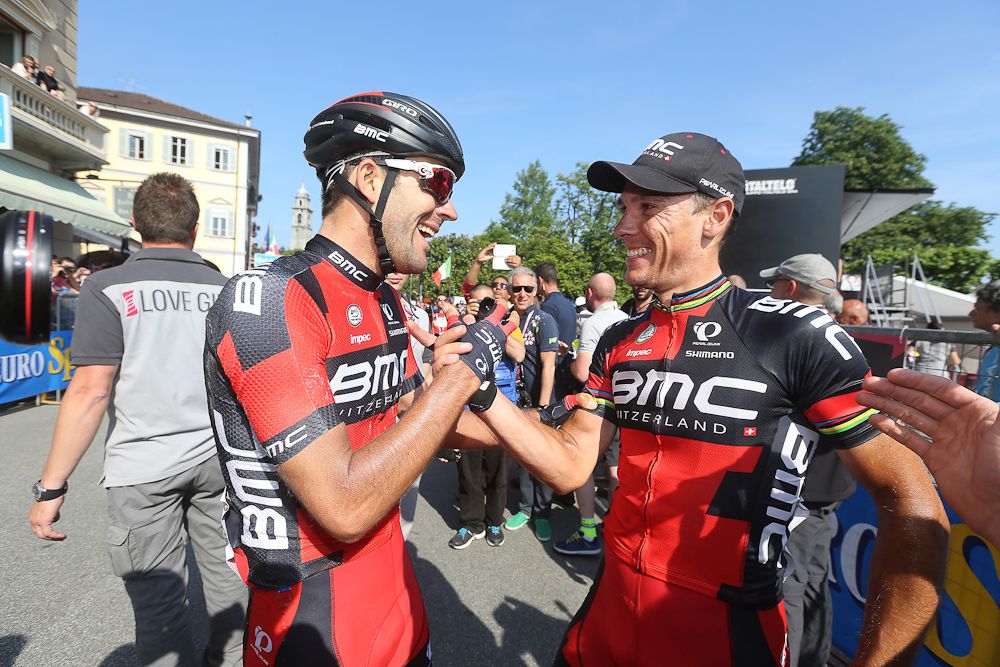 Philippe Gilbert is congratulated by a teammate.