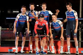 Remco Evenepoel celebrates his 2022 Vuelta a España victory in Madrid with his QuickStep-AlphaVinyl teammates