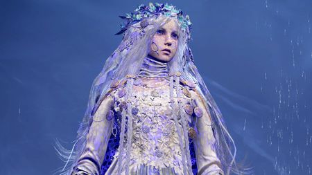 A young Elden Ring Nightreign character with long white hair standing in the rain