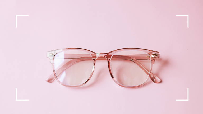 glasses on pink background