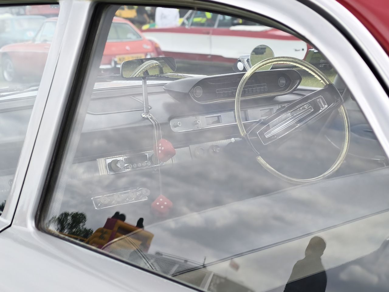 Interior of a classic car as seen through a window