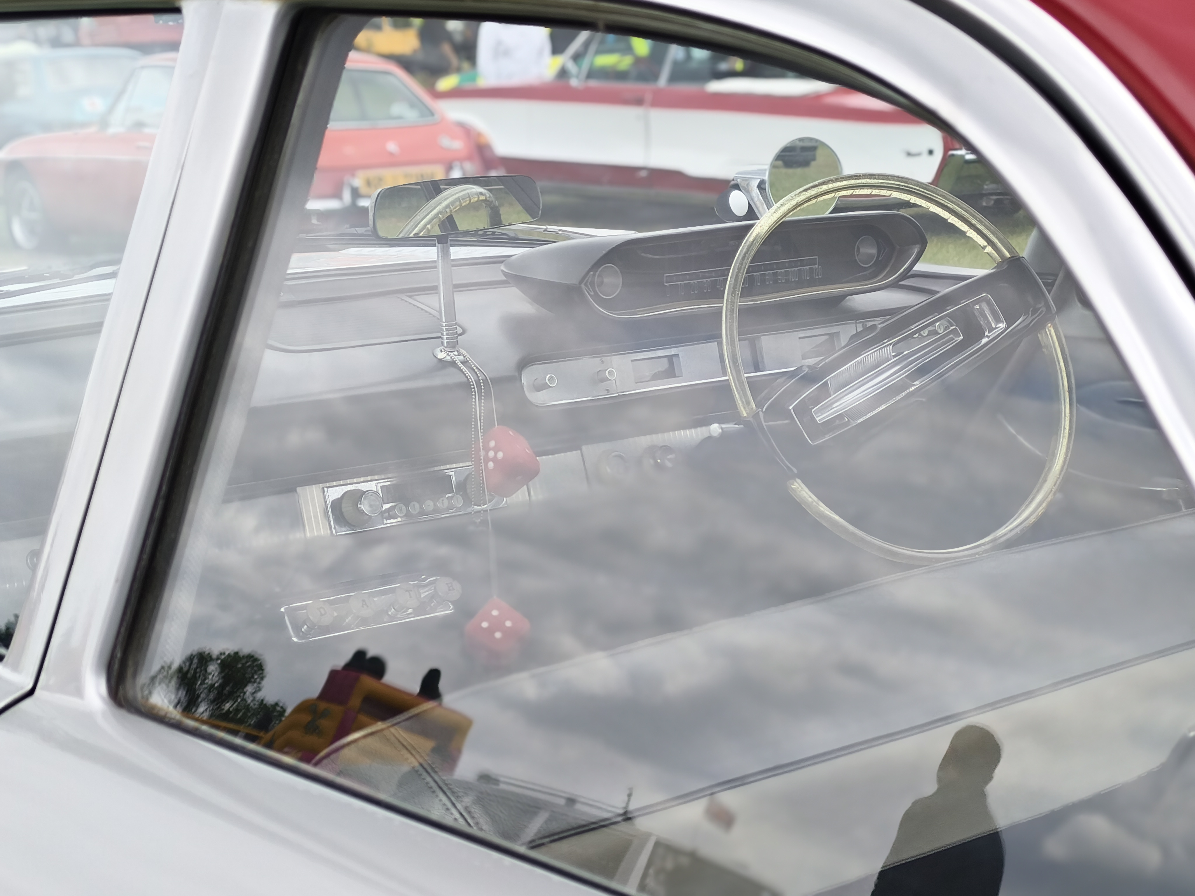 Interior of a classic car as seen through a window