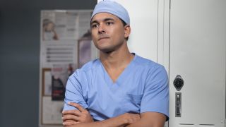 Lucas Adams (Niko Terho) crosses his arms and looks unhappy on the Grey's Anatomy Season 20 episode "I Carry Your Heart."