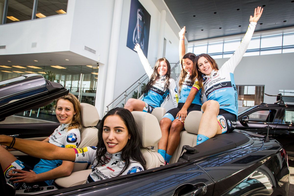 The girls hoping they get to take a test drive at the local BMW dealer.