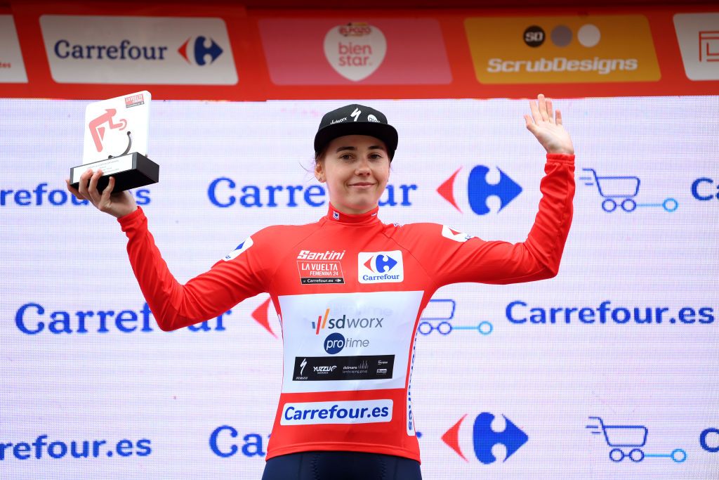 TERUEL SPAIN APRIL 30 Blanka Vas of Hungary and Team SD Worx Protime Red Leader Jersey celebrates at podium during the 10th La Vuelta Femenina 2024 Stage 3 a 1303km stage from Lucena del Cid to Teruel UCIWWT on April 30 2024 in Teruel Spain Photo by Alex BroadwayGetty Images