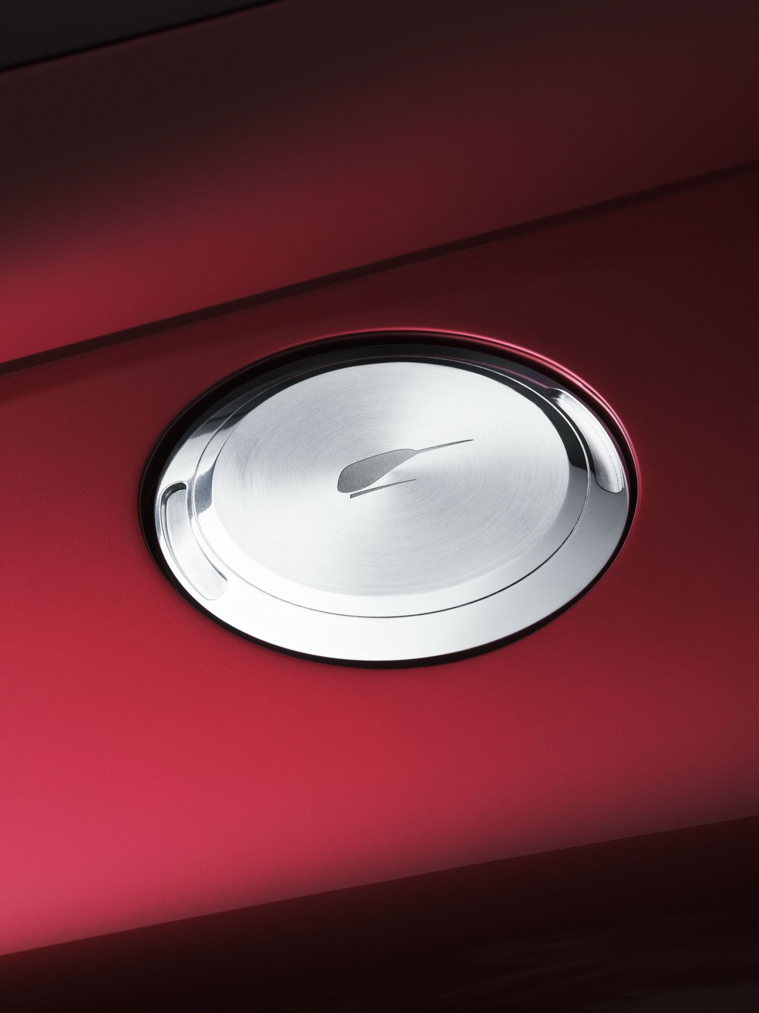 Details of the new McLaren McL6GT, finished in a deep red, looking like a 1970s American racer.