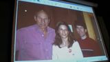 A computer screen shows a photo featuring Todd Howard, his wife, and Patrick Stewart