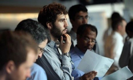 Job applicants wait to meet potential employers at a New York City job fair on Sept. 28: In October, the U.S. economy added a better-than-expected 171,000 jobs.