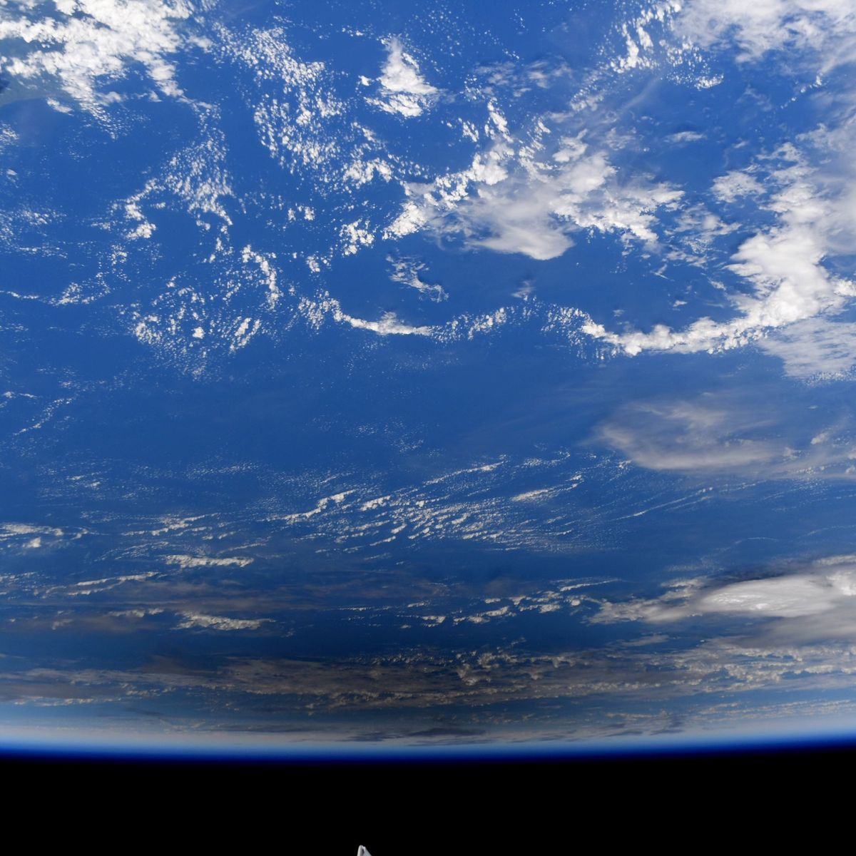 NASA astronaut Jessica Meir captured these photos of the Dec. 26, 2019 annular solar eclipse from the International Space Station. They show the moon's shadow moving across the surface of the Earth.