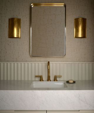 modern bathroom brass wall sconces by emily lauren interiors