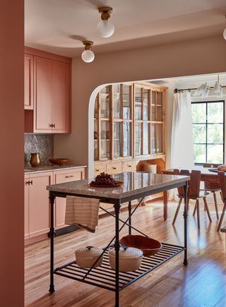 pink kitchen with metal worktable