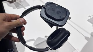 Nothing Headphone (1) in black held in the hand