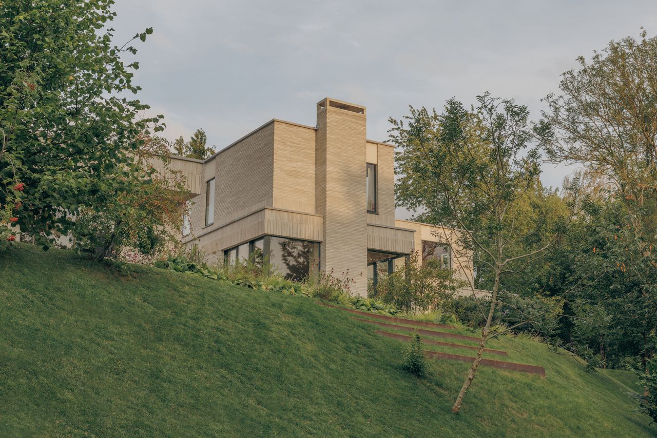 A serene riverside home in the British countryside unites minimalism and nature