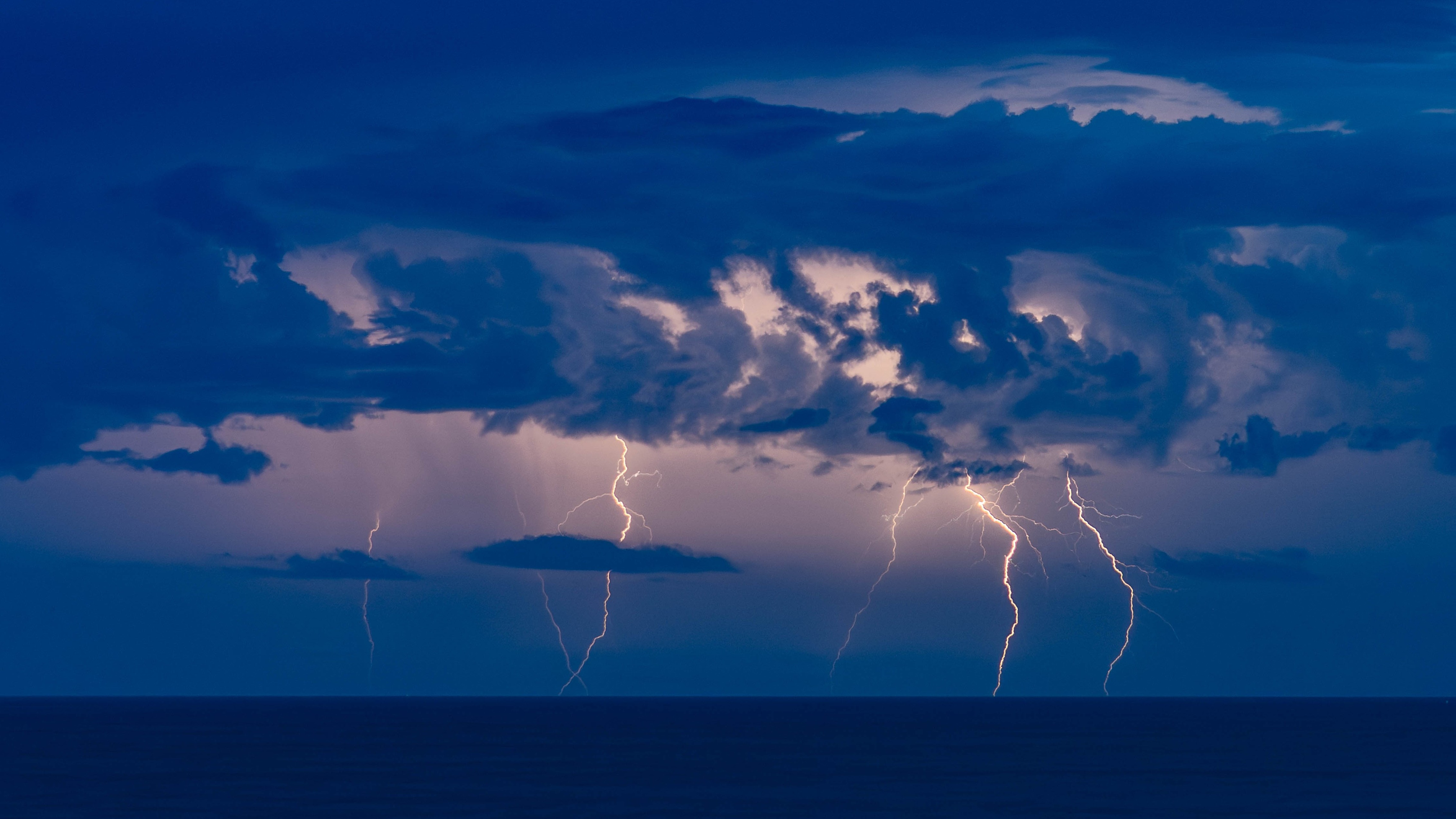 A lightning storm over a dark sea.