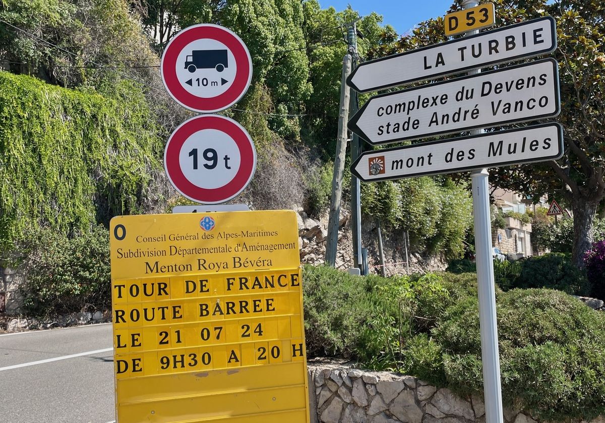 Signage for the 2024 Tour de France at the base of Mont de Mules, the major climb of stage 21
