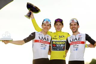 2023 Tour de France overall podium (L-R): best young rider Tadej Pogačar (UAE Team Emirates) in second, winner Jonas Vingegaard (Jumbo-Visma) and third place Adam Yates (UAE Team Emirates)