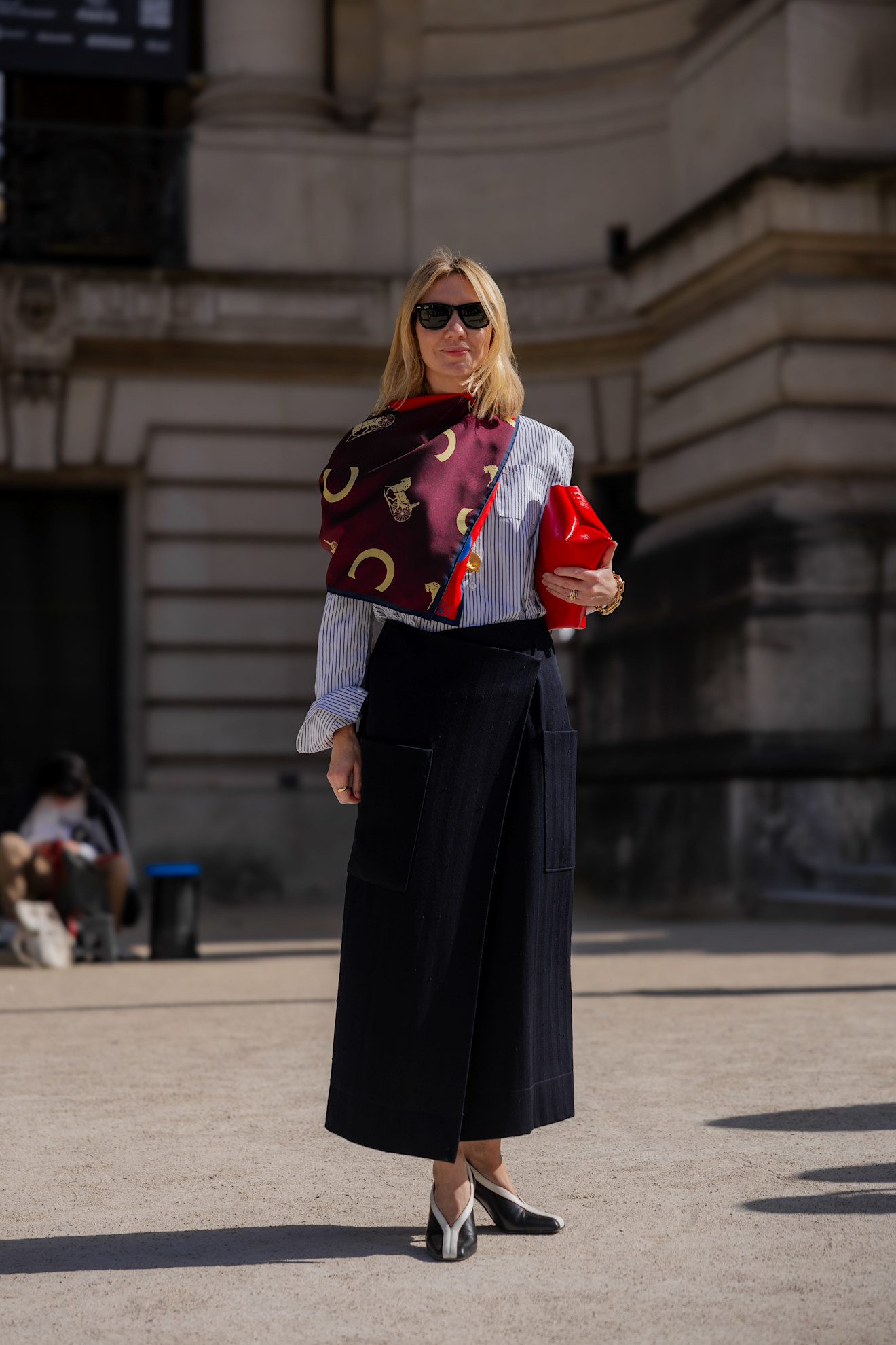 paris fashion week attendee wearing tie scarf, black skirt