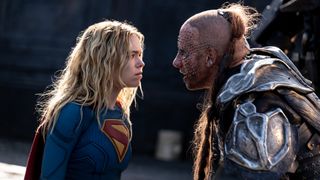 Milly Alcock and Matthias Schoenaerts glaring at each other in Supergirl