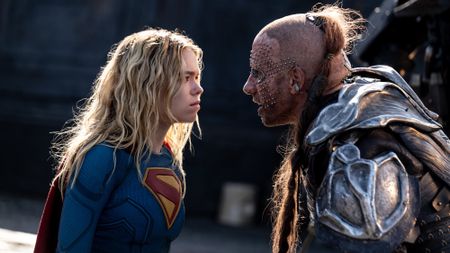 Milly Alcock and Matthias Schoenaerts glaring at each other in Supergirl