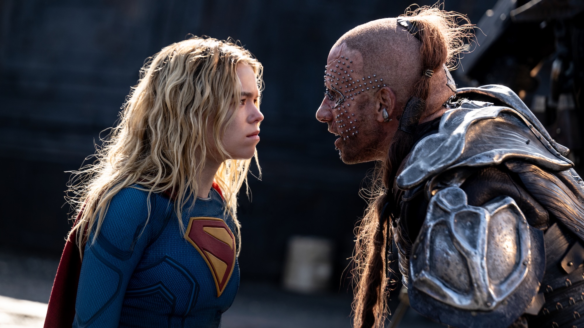 Milly Alcock and Matthias Schoenaerts glaring at each other in Supergirl