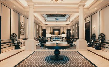 Grand indoor seating area with white pillars