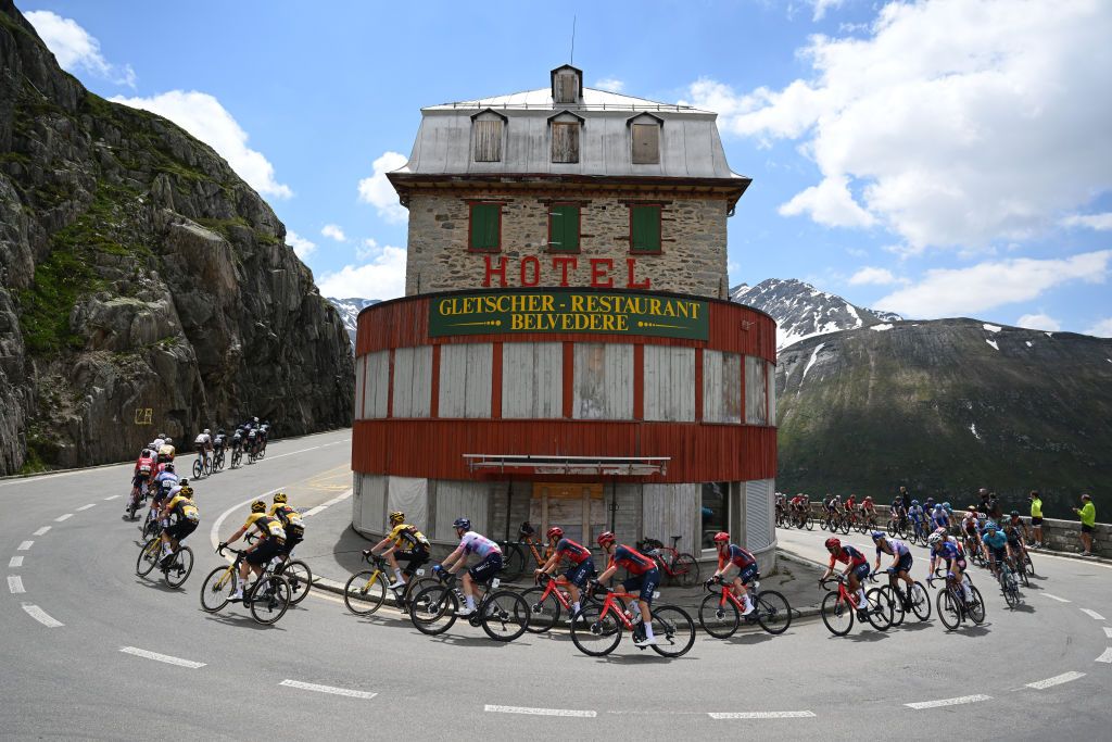 LA PUNT SWITZERLAND JUNE 15 LR Tom Pidcock of United Kingdom Magnus Sheffield of The United States Jhonnatan Narvaez of Ecuador and Team INEOS Grenadiers and a general view of the peloton competing at the Col de la Furka 2429m passing in front of the Htel Belvdre during the 86th Tour de Suisse 2023 Stage 5 a 211km stage from Fiesch to La Punt 1696m UCIWT on June 15 2023 in La Punt Switzerland Photo by Dario BelingheriGetty Images