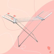 Winged heated clothes airer against pink background