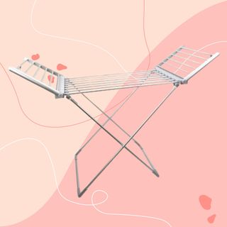 Winged heated clothes airer against pink background