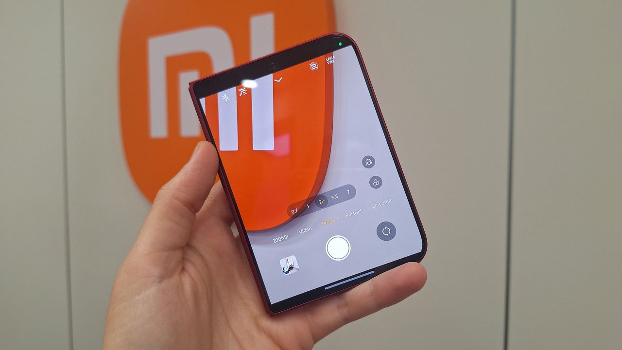 The Xiaomi 18 Fold being held in the hand