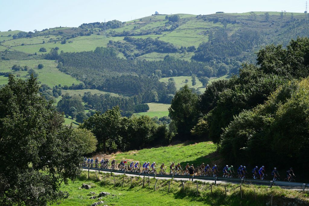 SANTA CRUZ DE BEZANA SPAIN AUGUST 31 A general view of the peloton competing during the 76th Tour of Spain 2021 Stage 16 a 180km stage from Laredo to Santa Cruz de Bezana lavuelta LaVuelta21 on August 31 2021 in Santa Cruz de Bezana Spain Photo by Tim de WaeleGetty Images
