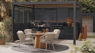contemporary aluminium pergola on patio area with outdoor kitchen and dining area