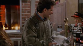 Jerry with nutria hat in Kenny Roger's Roasters in Seinfeld