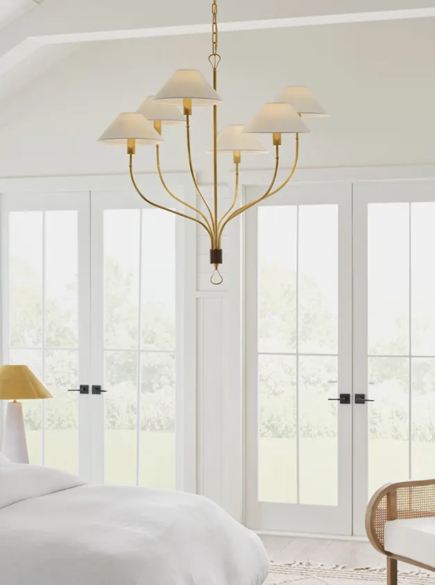 chandelier in a white bedroom