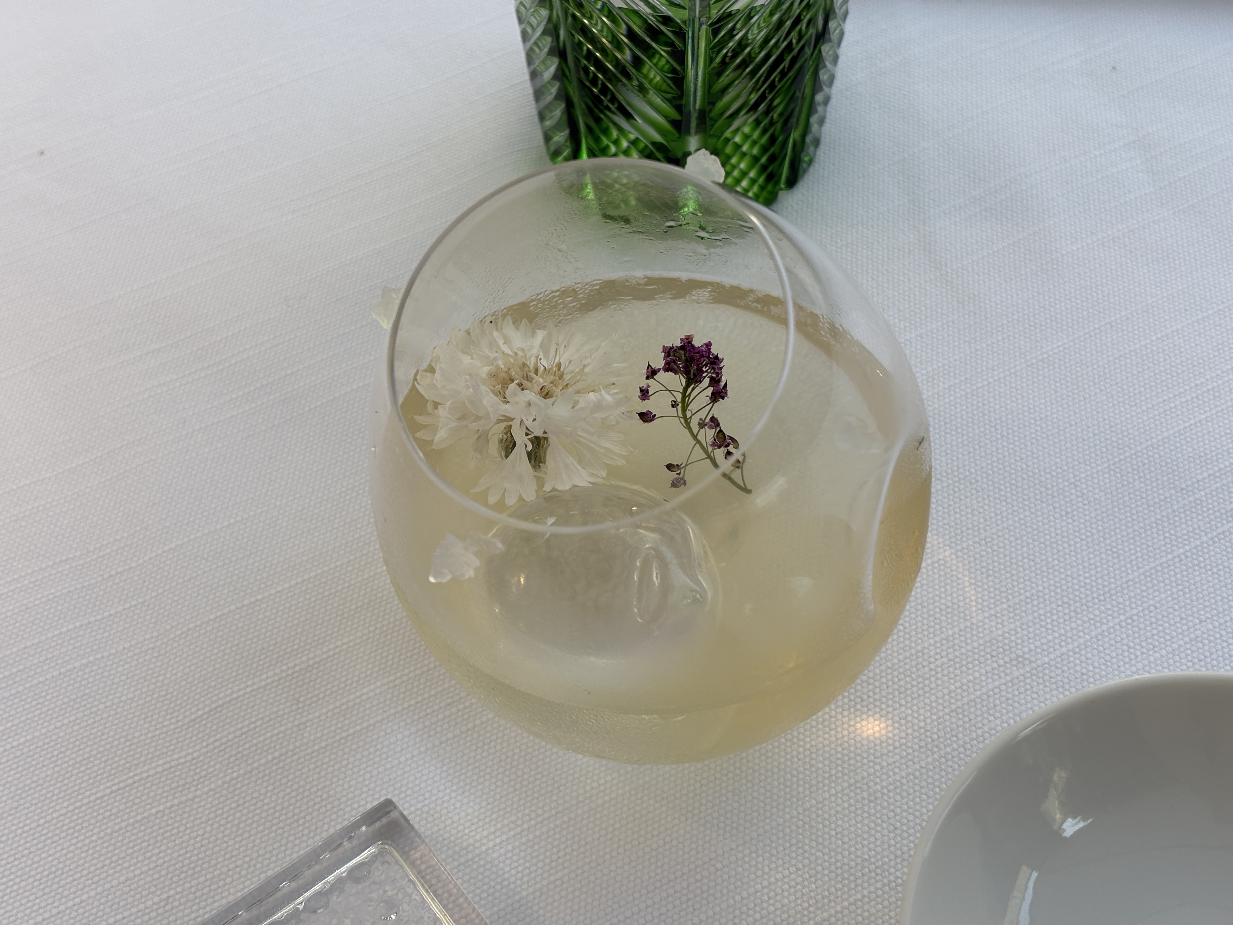 view of some of the dishes at monsieur dior restaurant by mauro colagreco