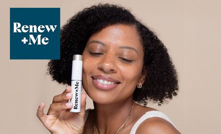 Woman holding and Renew + Me product next to her face and smiling