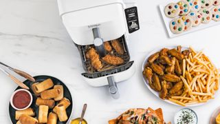 White Ninja Double Stack air fryer with various fried foods