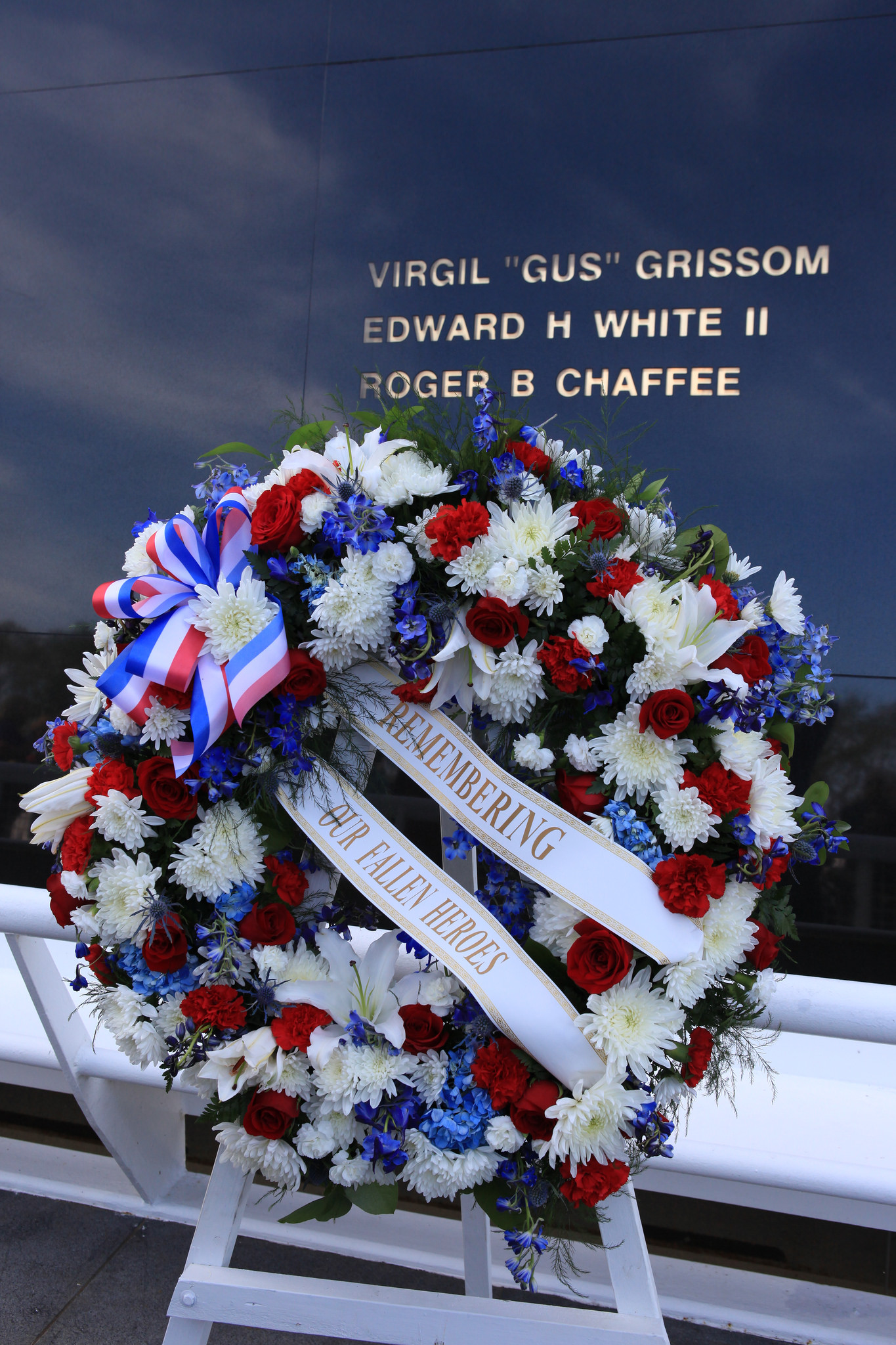 Family members of fallen NASA astronauts placed a wreath at the Space Mirror Memorial at Kennedy Space Center's Day of Remembrance ceremony. The names of astronauts lost in the Apollo 1 fire, Challenger and Columbia shuttle accidents, as well as astronauts who perished in training and commercial airplane accidents are emblazoned on the monument's 45-foot-high-by-50-foot-wide polished black granite surface.