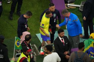 Neymar of Brazil leaves the pitch after injury during the FIFA World Cup Qatar 2022 Group G match between Brazil and Serbia at Lusail Stadium in Lusail City, Qatar on November 24, 2022.
