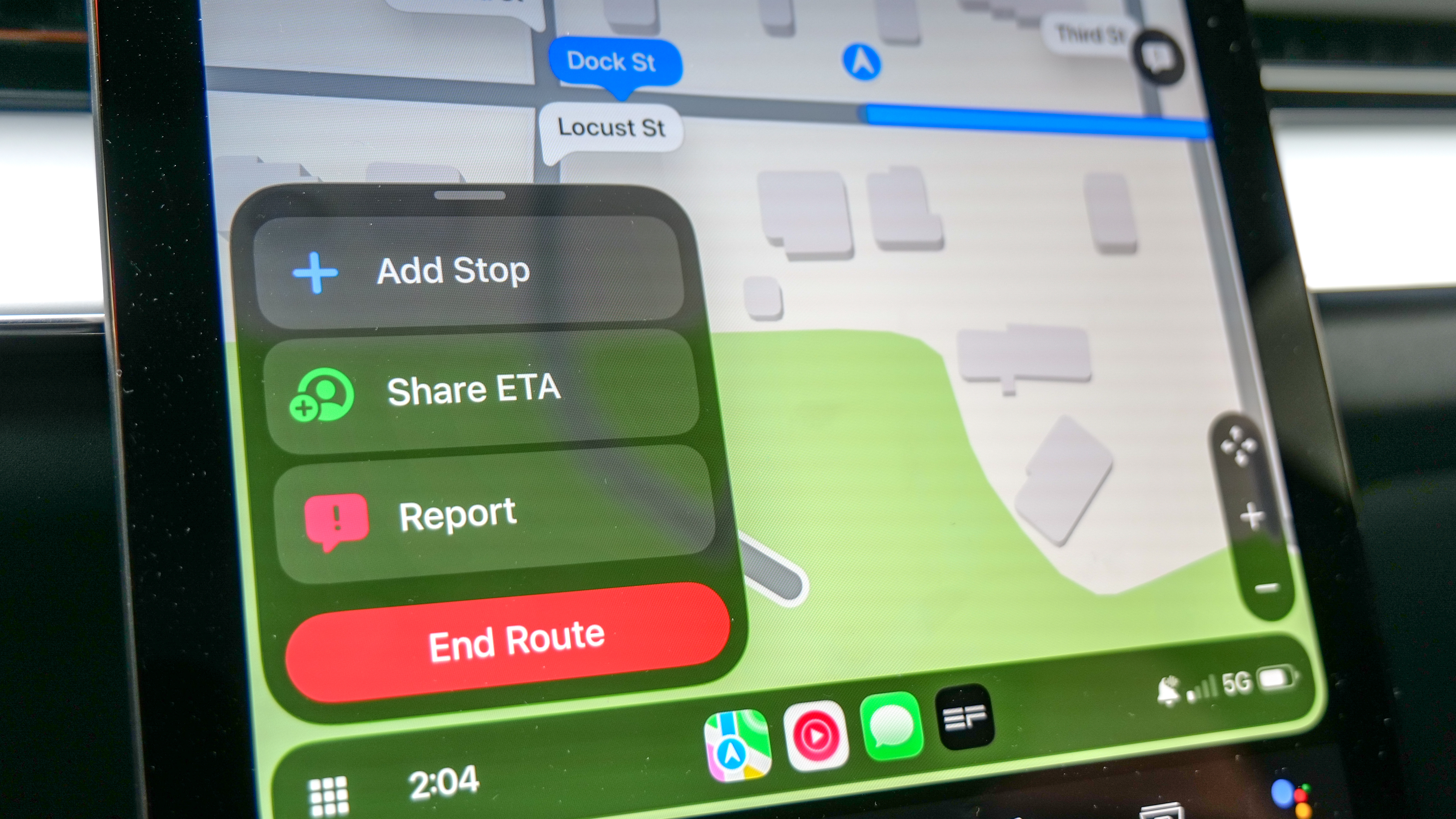 Apple Maps in CarPlay showing Share ETA button.