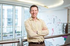 Three CEO David Dyson with arms folded