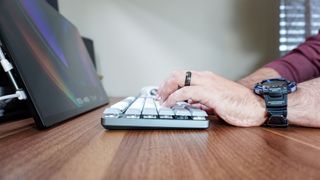 Typing on the Satechi SM3 keyboard seen from the side