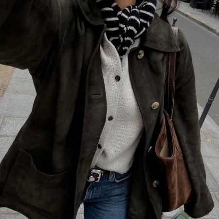 woman in suede jacket, cardigan, and scarf