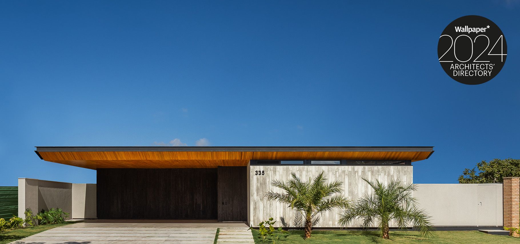 low level modernist house with blue sky