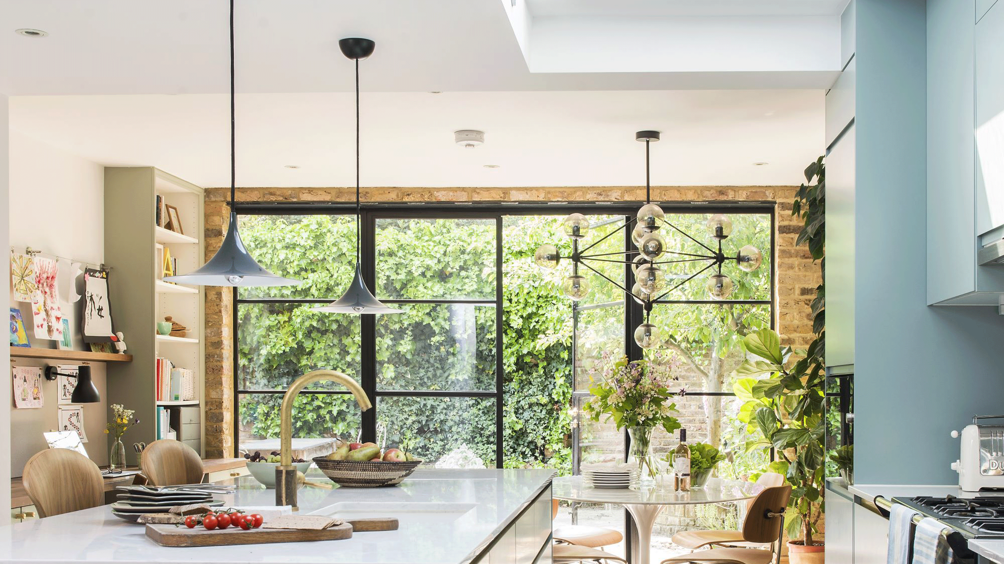 Open plan kitchen with island overlooking garden