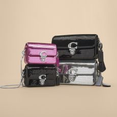 Four sequin Coach bags in black, silver and fuchsia 