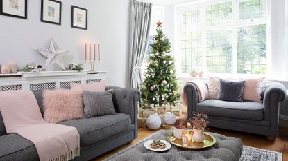white living room with grey sofa